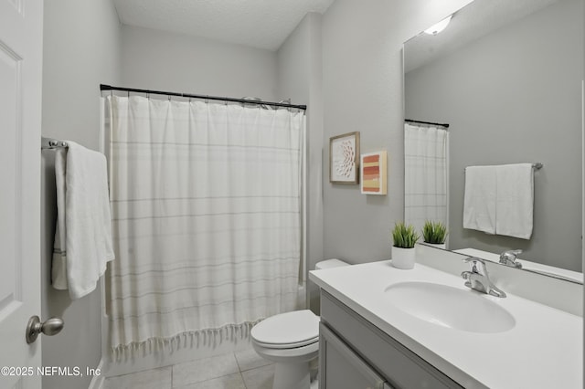 48 Foxcross Ave, Saint Augustine, FL 32092 - full bath with toilet, vanity, a textured ceiling, and tile patterned floors