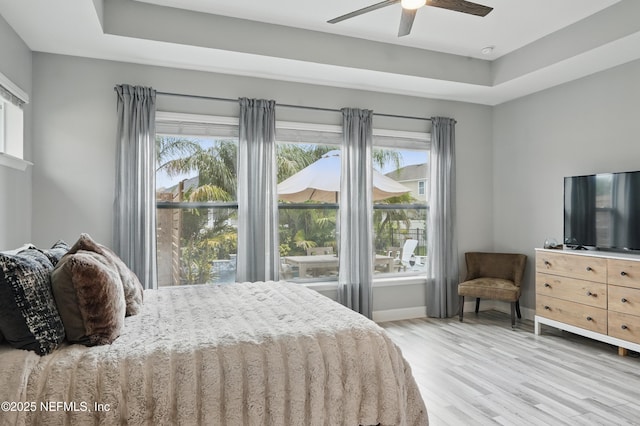 48 Foxcross Ave, Saint Augustine, FL 32092 - bedroom featuring multiple windows, wood finished floors, and baseboards