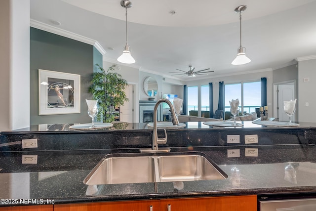 1925 S Atlantic Ave Unit 1005, Daytona Beach Shores, FL 32118 - kitchen with a sink, crown molding, stainless steel dishwasher, open floor plan, and decorative light fixtures