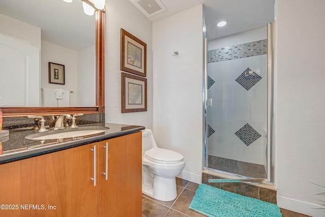 1925 S Atlantic Ave Unit 1005, Daytona Beach Shores, FL 32118 - bathroom featuring a stall shower, vanity, toilet, tile patterned floors, and baseboards