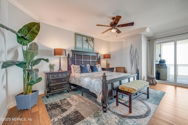 1925 S Atlantic Ave Unit 1005, Daytona Beach Shores, FL 32118 - bedroom with access to exterior, ornamental molding, wood finished floors, baseboards, and ceiling fan