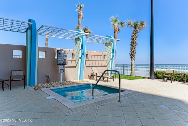 1925 S Atlantic Ave Unit 1005, Daytona Beach Shores, FL 32118 - view of pool with a pergola, a patio, and a water view
