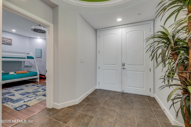 1925 S Atlantic Ave Unit 1005, Daytona Beach Shores, FL 32118 - foyer featuring dark tile patterned flooring, baseboards, and recessed lighting