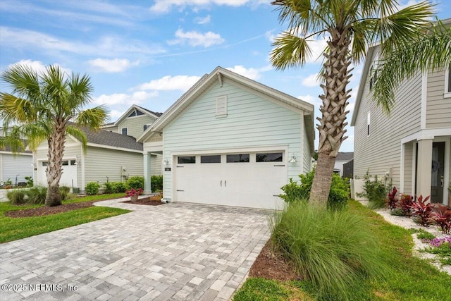 46 Killarney Ave, Saint Johns, FL 32259 - view of front of property with decorative driveway and a garage