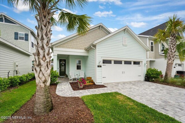 46 Killarney Ave, Saint Johns, FL 32259 - craftsman-style house featuring a garage and decorative driveway