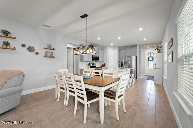 46 Killarney Ave, Saint Johns, FL 32259 - dining space with light wood-type flooring, recessed lighting, and baseboards