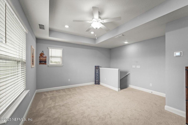 46 Killarney Ave, Saint Johns, FL 32259 - empty room featuring a tray ceiling, carpet flooring, a ceiling fan, baseboards, and recessed lighting