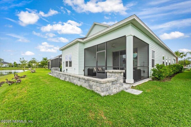 46 Killarney Ave, Saint Johns, FL 32259 - view of side of property featuring a sunroom, a yard, and a water view