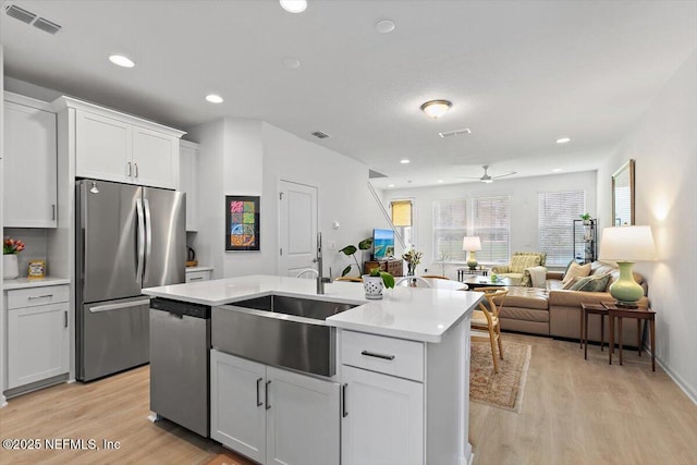 233 Brandon Lakes Dr, Saint Augustine, FL 32092 - kitchen with appliances with stainless steel finishes, a sink, light wood-style floors, light countertops, and recessed lighting