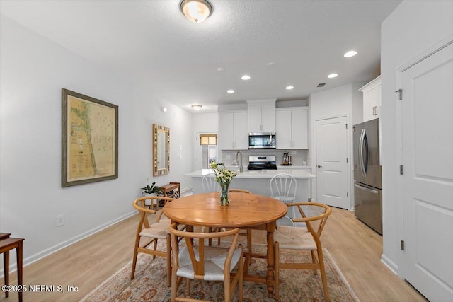233 Brandon Lakes Dr, Saint Augustine, FL 32092 - dining room featuring light wood-style flooring, recessed lighting, and baseboards