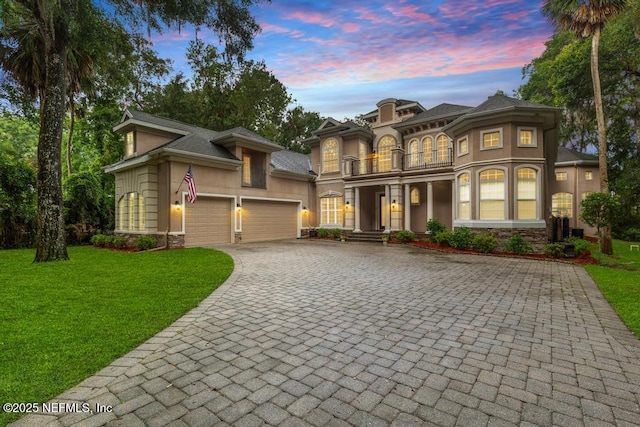 69 Bridle Ridge Ct, Flagler Beach, FL 32136 - view of front of home with a balcony, decorative driveway, stucco siding, and stone siding