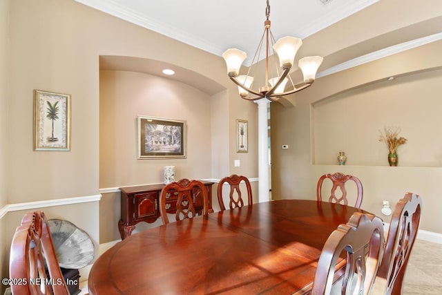 69 Bridle Ridge Ct, Flagler Beach, FL 32136 - dining space featuring a chandelier and ornamental molding