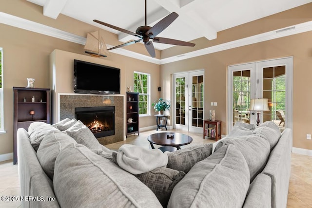 69 Bridle Ridge Ct, Flagler Beach, FL 32136 - living area featuring french doors, baseboards, light tile patterned flooring, ceiling fan, and a high end fireplace