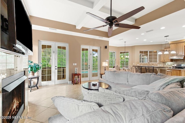 69 Bridle Ridge Ct, Flagler Beach, FL 32136 - living room with french doors, recessed lighting, light tile patterned flooring, beam ceiling, and ceiling fan
