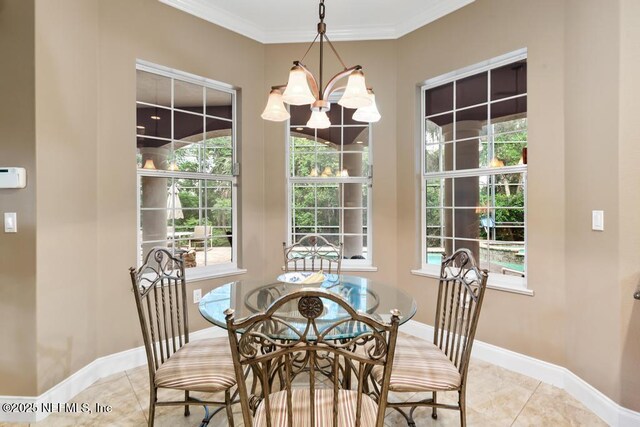 69 Bridle Ridge Ct, Flagler Beach, FL 32136 - dining area featuring light tile patterned floors, a chandelier, baseboards, and crown molding