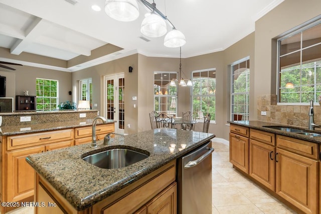 69 Bridle Ridge Ct, Flagler Beach, FL 32136 - kitchen featuring a sink, dishwasher, a kitchen island with sink, light tile patterned floors, and beam ceiling