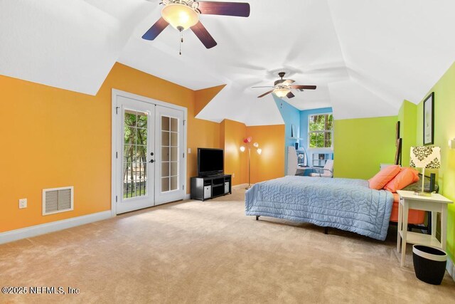 69 Bridle Ridge Ct, Flagler Beach, FL 32136 - bedroom featuring access to exterior, vaulted ceiling, french doors, carpet flooring, and baseboards