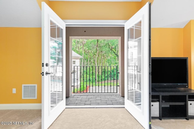 69 Bridle Ridge Ct, Flagler Beach, FL 32136 - entryway with french doors, carpet flooring, and baseboards