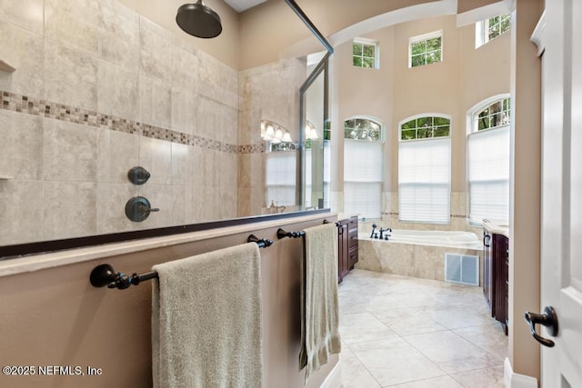 69 Bridle Ridge Ct, Flagler Beach, FL 32136 - full bathroom with a garden tub, vanity, tiled shower, and tile patterned floors