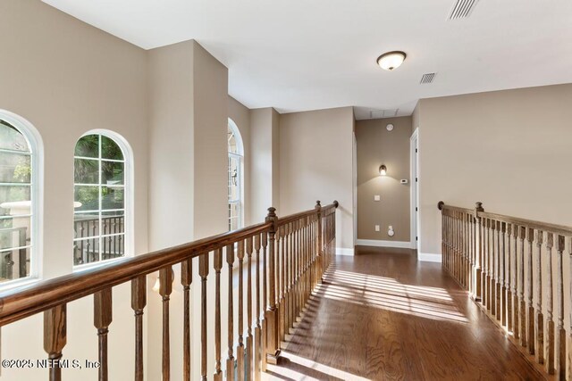 69 Bridle Ridge Ct, Flagler Beach, FL 32136 - corridor with wood finished floors and baseboards