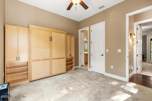 69 Bridle Ridge Ct, Flagler Beach, FL 32136 - unfurnished bedroom with light colored carpet, baseboards, and ceiling fan