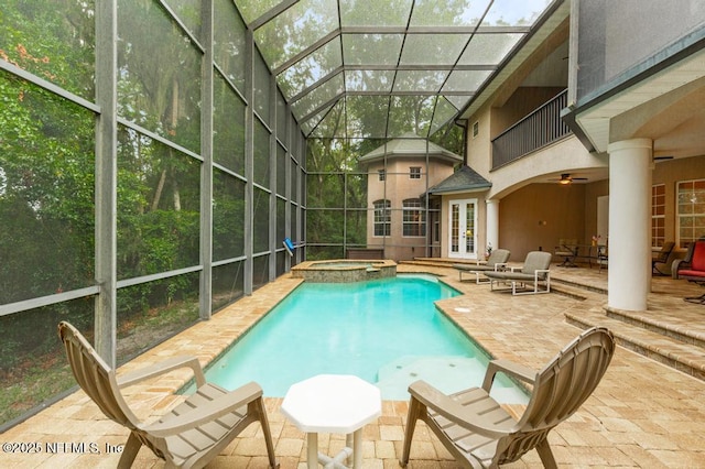 69 Bridle Ridge Ct, Flagler Beach, FL 32136 - view of pool with french doors, a patio area, a pool with connected hot tub, ceiling fan, and glass enclosure