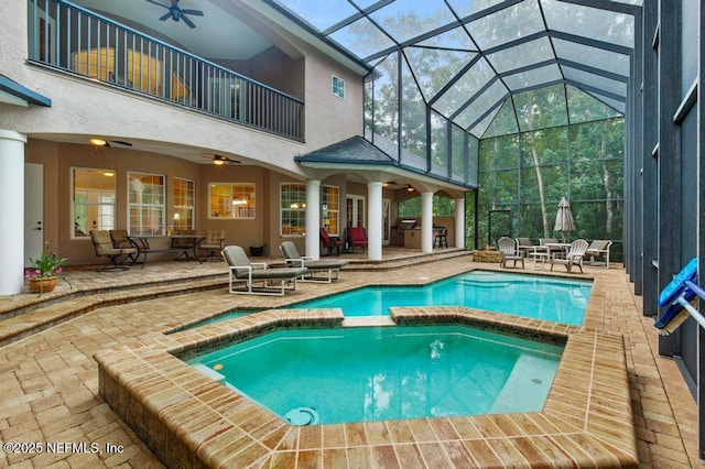 69 Bridle Ridge Ct, Flagler Beach, FL 32136 - view of pool featuring a ceiling fan, a pool with connected hot tub, a patio area, and a lanai
