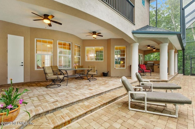 69 Bridle Ridge Ct, Flagler Beach, FL 32136 - view of patio featuring a ceiling fan, glass enclosure, and outdoor dining space