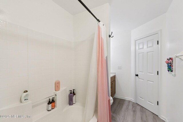 12357 Winterpine Ct, Jacksonville, FL 32225 - bathroom featuring shower / bath combo with shower curtain, wood finished floors, and vanity