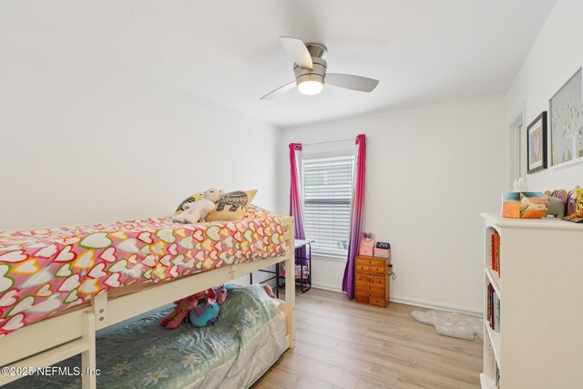 12357 Winterpine Ct, Jacksonville, FL 32225 - bedroom with light wood finished floors and ceiling fan