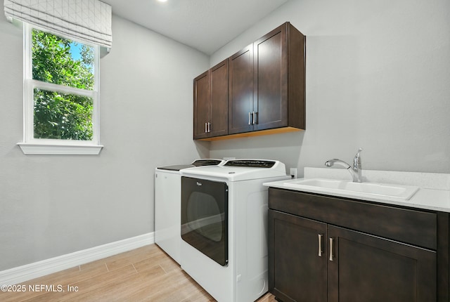96 Glenhurst Ave, Ponte Vedra, FL 32081 - laundry area with cabinet space, washer and dryer, and light wood-style flooring