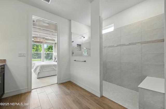 96 Glenhurst Ave, Ponte Vedra, FL 32081 - bathroom featuring wood finished floors, vanity, a walk in shower, and ensuite bath