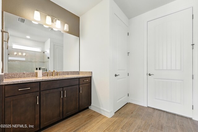 96 Glenhurst Ave, Ponte Vedra, FL 32081 - bathroom featuring vanity, a shower stall, and wood finished floors