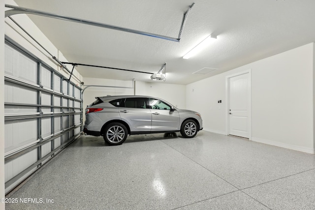96 Glenhurst Ave, Ponte Vedra, FL 32081 - garage with baseboards and a garage door opener