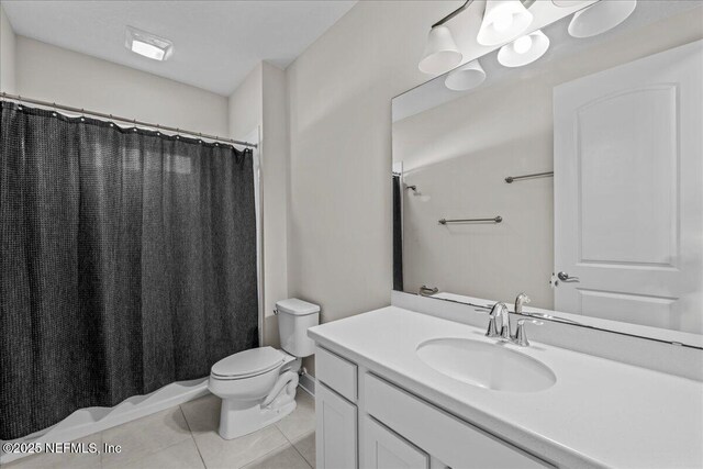 27 Shady Lake Ct, Saint Augustine, FL 32095 - full bathroom with tile patterned floors, toilet, vanity, and a shower with curtain