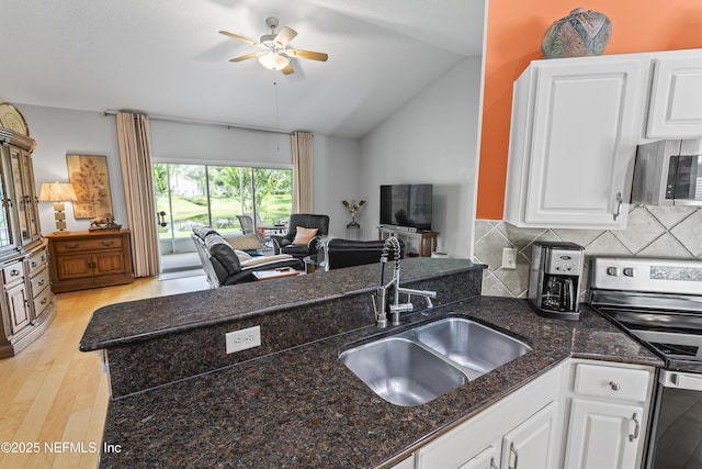 4340 Comanche Trail Blvd, Saint Johns, FL 32259 - kitchen featuring stainless steel appliances, ceiling fan, open floor plan, light wood-style floors, and lofted ceiling