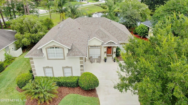 4340 Comanche Trail Blvd, Saint Johns, FL 32259 - view of front facade featuring roof with shingles, driveway, and stucco siding