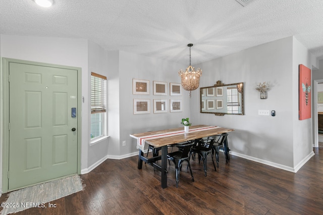 1501 Cove Landing Dr, Jacksonville, FL 32233 - dining area with a textured ceiling, a chandelier, plenty of natural light, wood finished floors, and baseboards