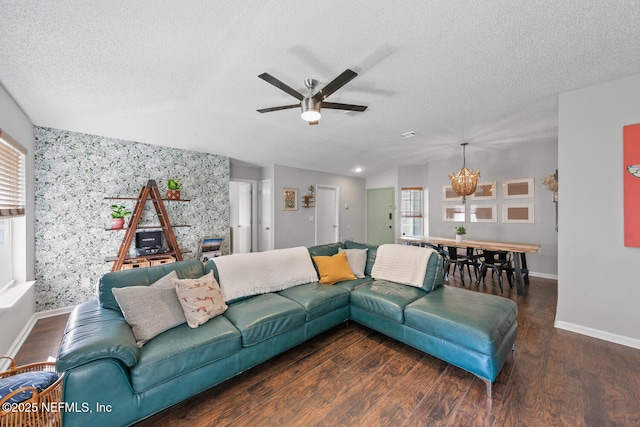 1501 Cove Landing Dr, Jacksonville, FL 32233 - living area featuring an accent wall, plenty of natural light, ceiling fan, baseboards, and a textured ceiling