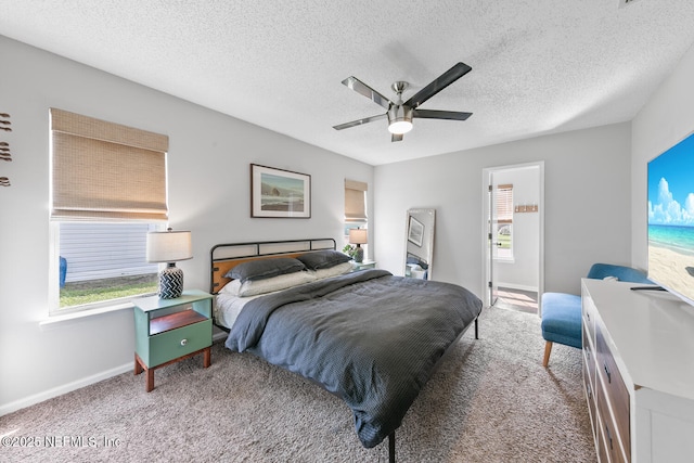 1501 Cove Landing Dr, Jacksonville, FL 32233 - bedroom featuring carpet floors, baseboards, a textured ceiling, and ceiling fan