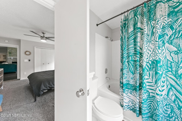 1501 Cove Landing Dr, Jacksonville, FL 32233 - ensuite bathroom with shower / bath combination with curtain, ceiling fan, toilet, a textured ceiling, and baseboards