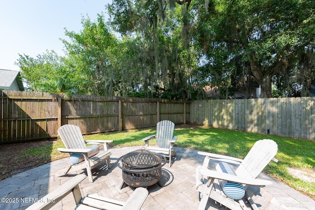 1501 Cove Landing Dr, Jacksonville, FL 32233 - fenced backyard with a fire pit and a patio area