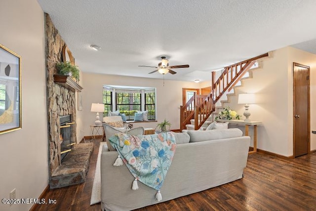 2768 N Periwinkle Ave, Middleburg, FL 32068 - living area featuring a ceiling fan, stairway, wood finished floors, baseboards, and a textured ceiling