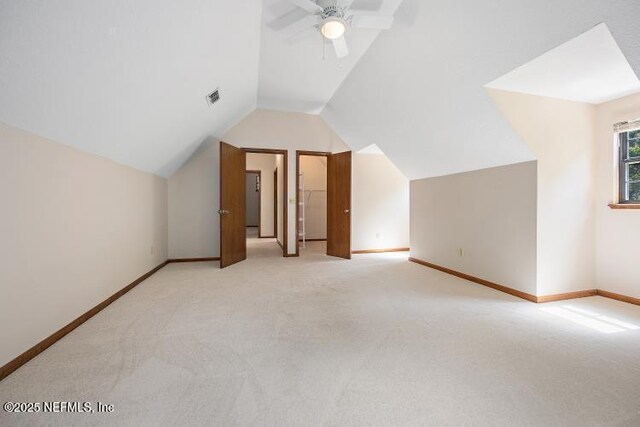 2768 N Periwinkle Ave, Middleburg, FL 32068 - additional living space with light colored carpet, vaulted ceiling, baseboards, and a ceiling fan