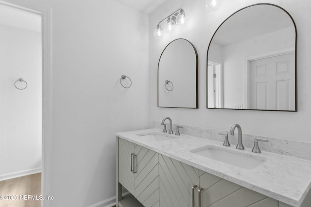 96002 Coral Reef Rd, Yulee, FL 32097 - full bathroom featuring double vanity, baseboards, and wood finished floors