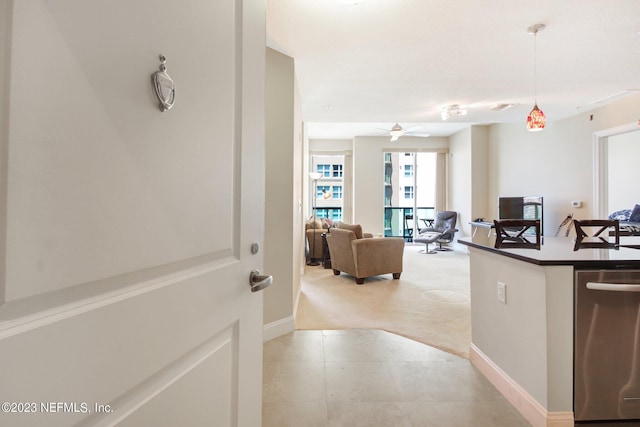 1431 Riverplace Blvd Unit 2202, Jacksonville, FL 32207 - hallway featuring light carpet, baseboards, and light tile patterned floors