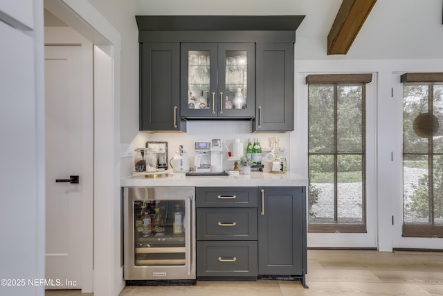 10351 County Road 13 N, Saint Augustine, FL 32092 - indoor dry bar featuring wine cooler, healthy amount of natural light, and light wood finished floors