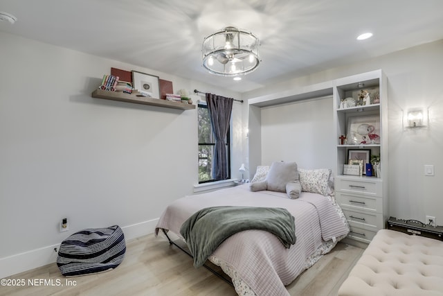 10351 County Road 13 N, Saint Augustine, FL 32092 - bedroom with light wood finished floors, recessed lighting, baseboards, and a chandelier