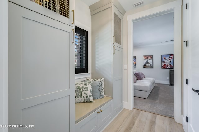 10351 County Road 13 N, Saint Augustine, FL 32092 - mudroom with light wood finished floors, baseboards, and ornamental molding