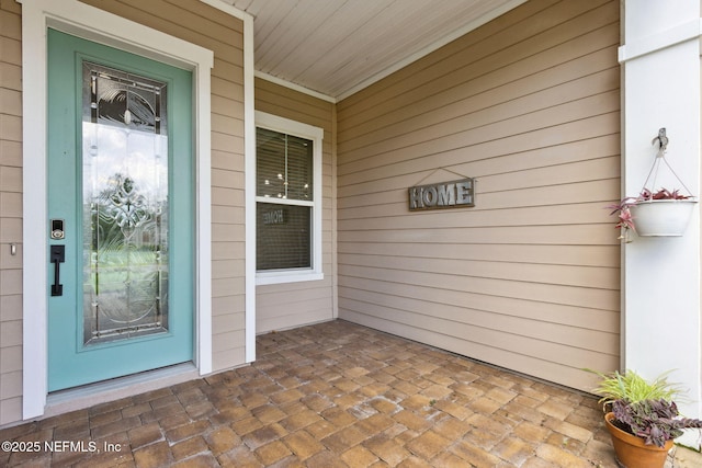 96167 Grande Oaks Ln, Fernandina Beach, FL 32034 - doorway to property featuring covered porch